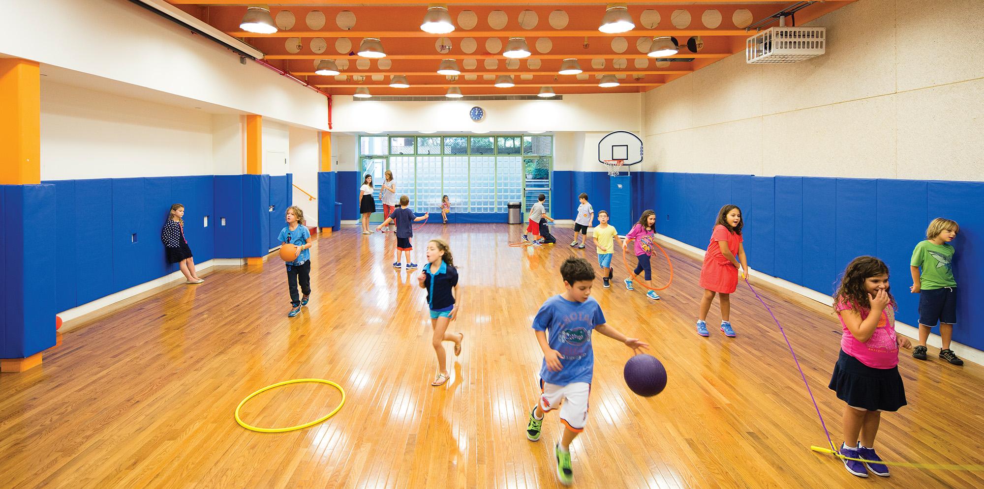 Children inside gymnasium at Columbia Grammar school